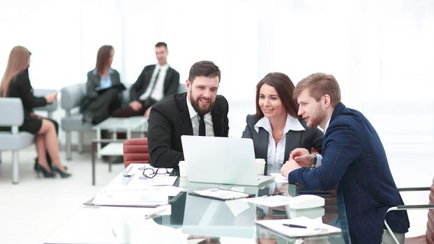 successful business team uses a laptop to plan their work.photo with copy space