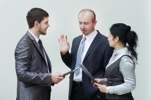 staff discuss business documents,standing in the lobby of the office.photo with copy space