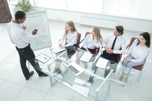 top view.business team at presentation of a new financial project.photo with copy space