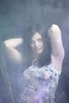 portrait of a pretty young woman. effect of clouds.isolated
