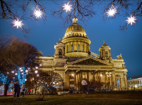 ST-PETERSBURG, RUSSIA - 03.01.2020: St. Isaac's Cathedral in St. Petersburg in the Christmas illumination at night.