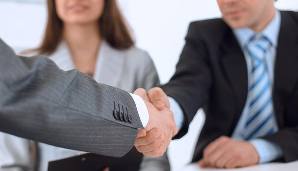 concept of cooperation: handshake of business partners