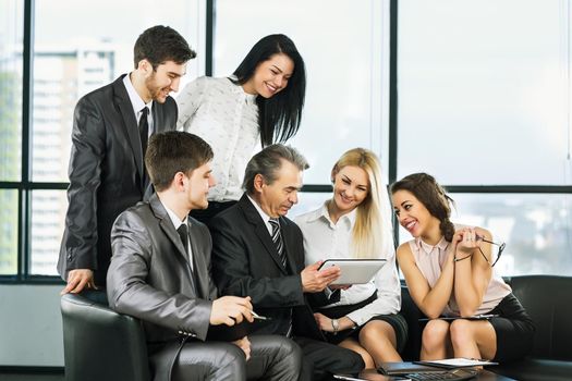 A group of businessmen discussing the policy of the company in the office.