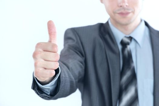 closeup.young business men showing thumb up.