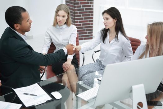 handshake of business partners in a modern office.business concept