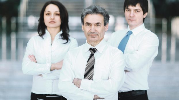 portrait business working group standing in office.the concept of teamwork