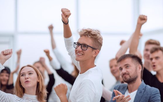 close up. a group of cheerful young people applauding. photo with copy space