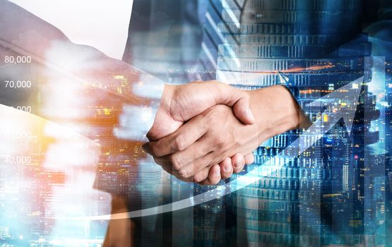 Business handshake on finance prosperity and money technology asset background . Economy and financial growth by investment in valuable stock market to gain wealth profit form currency trading