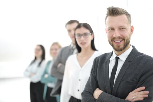 confident businessman standing in front of his business team.photo with copy space
