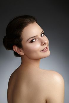 Beautiful face of young woman. Skincare, wellness, spa. Clean soft skin, healthy fresh look. Natural daily makeup.