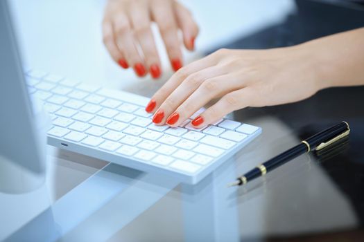 closeup.business woman typing text on the computer keyboard.people and technology