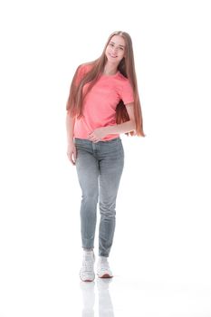 young woman in jeans and t-shirt goes forward.isolated on white.