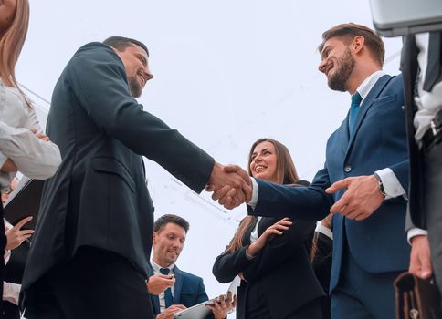 welcome and handshake of business partners in the office.bottom view