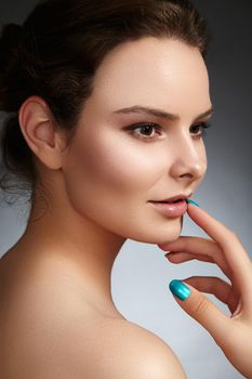 Beautiful face of young woman. Skincare, wellness, spa. Clean soft skin, healthy fresh look. Natural daily makeup.