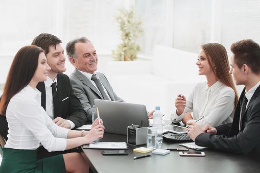 business colleagues talking at Desk in the office.the concept of teamwork