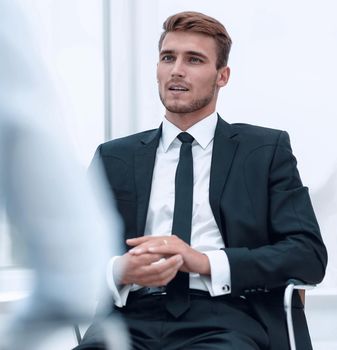 closeup . serious businessman sitting in an office chair.business people.