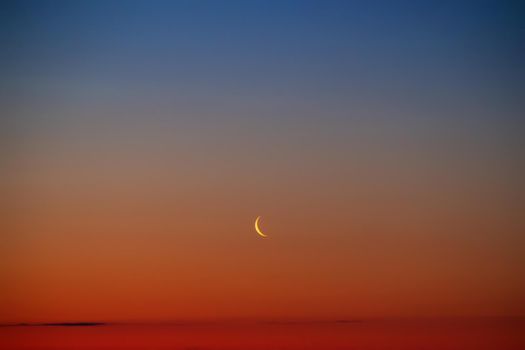 Sunset or sunrise with clouds . Red sunset and moon . beautiful sky . Prayer time . Generous Ramadan . Mubarak background .