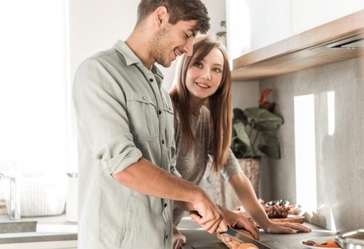 close up. beautiful young couple preparing Breakfast together . the concept of family happiness