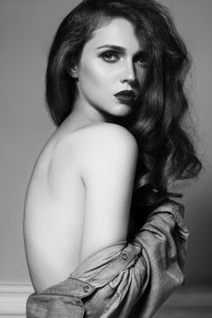 Beautiful Long Hair on an Attractive Woman. Fashion style with glamour makeup. Retro sexy look. Black and white photoshot