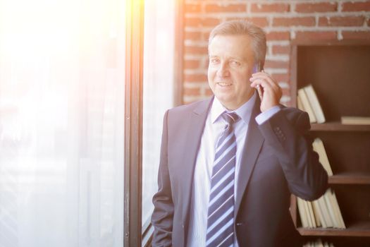 smiling business men talking on the phone.photo with copy space