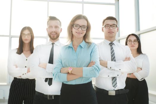 close up.serious businesswoman and her business team standing together