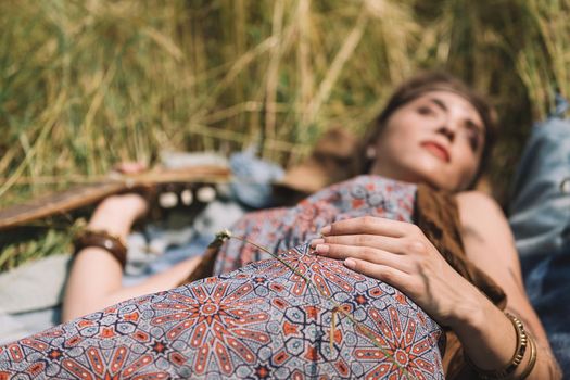 close up.beautiful hippie woman sleeping on the grass