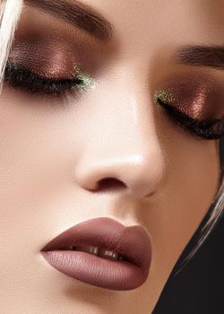 Closeup portrait with of beautiful woman face. Fashion makeup, clean shiny skin. Makeup and cosmetic. Beauty style on model face. Blond hair style