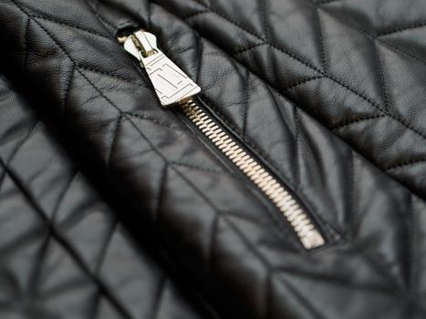 Close up detail of leather black jacket. Low DOF.