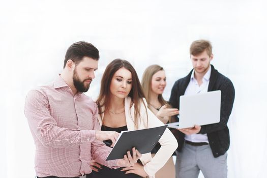 business team discusses the working documents before the business meeting.