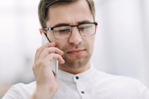 close up. businessman talking on mobile phone . business concept