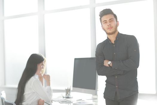 young businessman standing in his office. photo with copy space