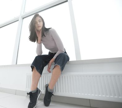 young entrepreneur sitting in an empty new office. photo with copy space