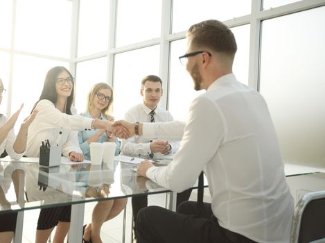 businesswoman shaking hands with the candidate for the vacant position . the concept of successful business casting