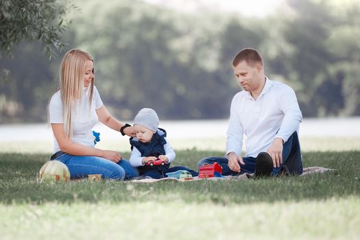 loving parents and their little son have fun together. the concept of parenting