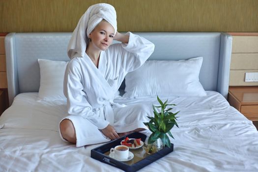 Beautiful Luxury Life. Breakfast. Happy Girl with a Cup of Coffee. Home Style Relaxation Woman Wearing Bathrobe and Towel after Shower. Spa Good Morning.