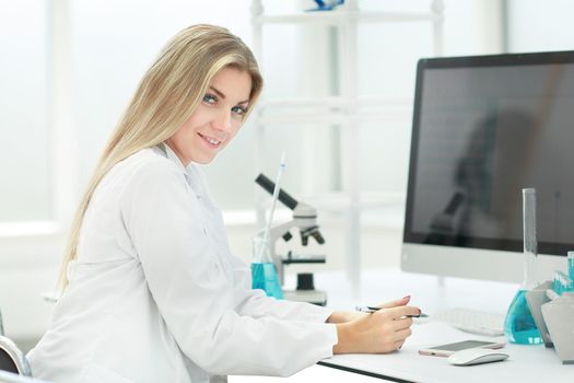 woman scientist in the workplace in the laboratory . science and health