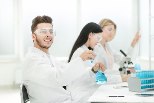 group of scientists conduct research in the laboratory . science and health