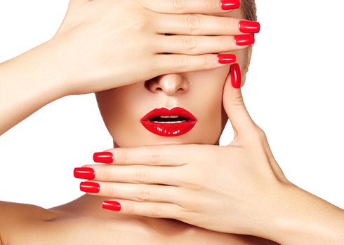 Red lips and bright manicured nails. Sexy open mouth. Beautiful manicure and makeup. Celebrate make up and clean skin. Kiss