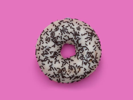 Donuts with icing on pastel pink background. Sweet donuts.