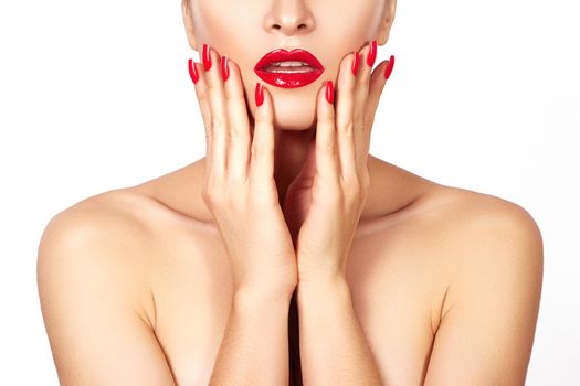 Red lips and bright manicured nails. Sexy open mouth. Beautiful manicure and makeup. Celebrate make up and clean skin. Kiss