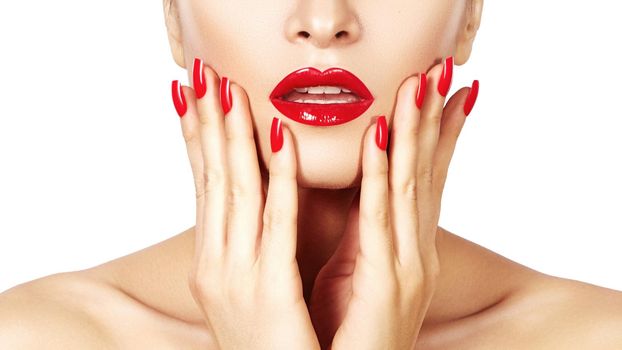 Red lips and bright manicured nails. Sexy open mouth. Beautiful manicure and makeup. Celebrate make up and clean skin. Kiss