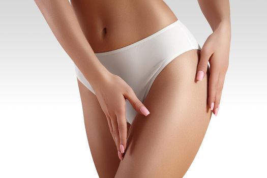 Spa and wellness. Healthy slim body in white panties. Beautiful sexy hips with clean skin. Fitness or plastic surgery. Perfect buttocks without cellulite.