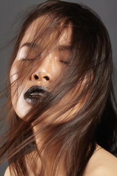 Fashion Model with Long Blowing Hair. Glamour Asian Beautiful Woman with Beautiful Brown Hair. Fashion Style, Clean Skin.