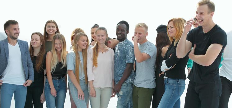 in full growth. group of cheerful young people looking at the camera. isolated on white