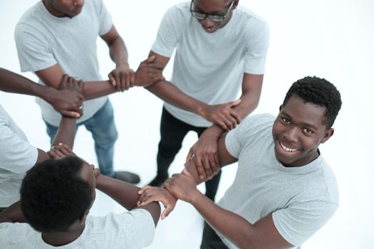 close up. group of diverse guys standing in a circle . isolated on white background