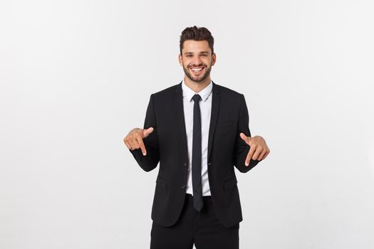 Business Concept: Portrait handsome young businessman point finger on side to empty copy space. Isolated over white background.