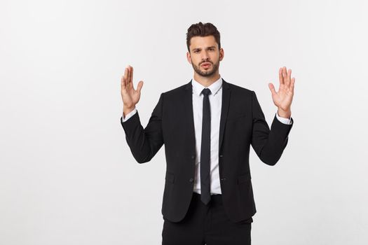 A man shows with his hands a large size on an isolated background.