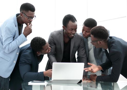 close up. serious business team looking at laptop screen