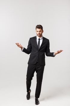 Portrait onfident young handsome businessman or model looking at camera isolated on white background.