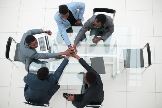 top view. a group of young business people showing their unity. the concept of teamwork